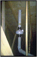 Radon Techniques for New Home Construction: pipe with a wide bit. Maybe that is a fan?