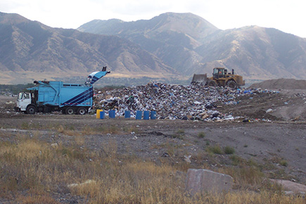 Landfill with a truck and bulldozer